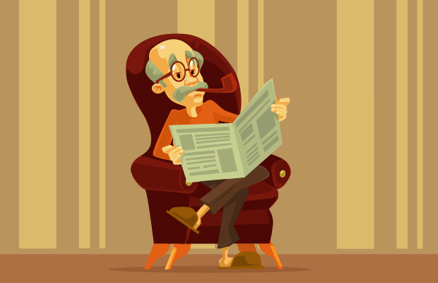 Hombre mayor leyendo el periódico.