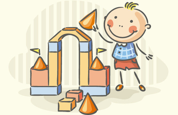 Niño con bloques de cuerpos geométricos