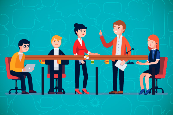 Grupo de personas en mesa de reuniones