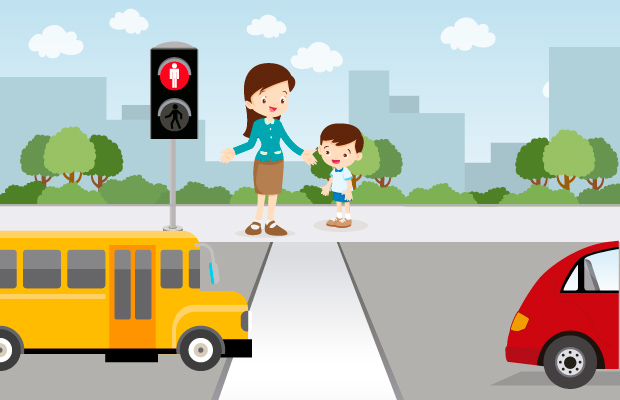 Mujer ayudando a niño a cruzar la calle.
