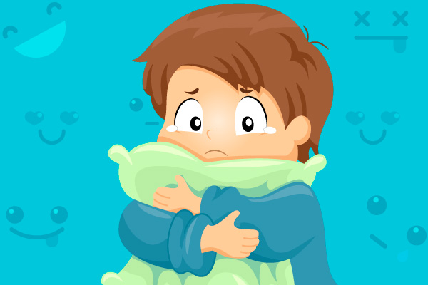 NIÑO TRISTE ABRAZANDO SU ALMOHADA